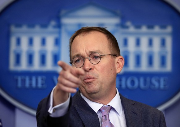 In this March 22, 2018 file photo, Office of Management and Budget Director Mick Mulvaney speaks in the Brady press briefing room at the White House in Washington. Mulvaney says he expects to stay on  ...
