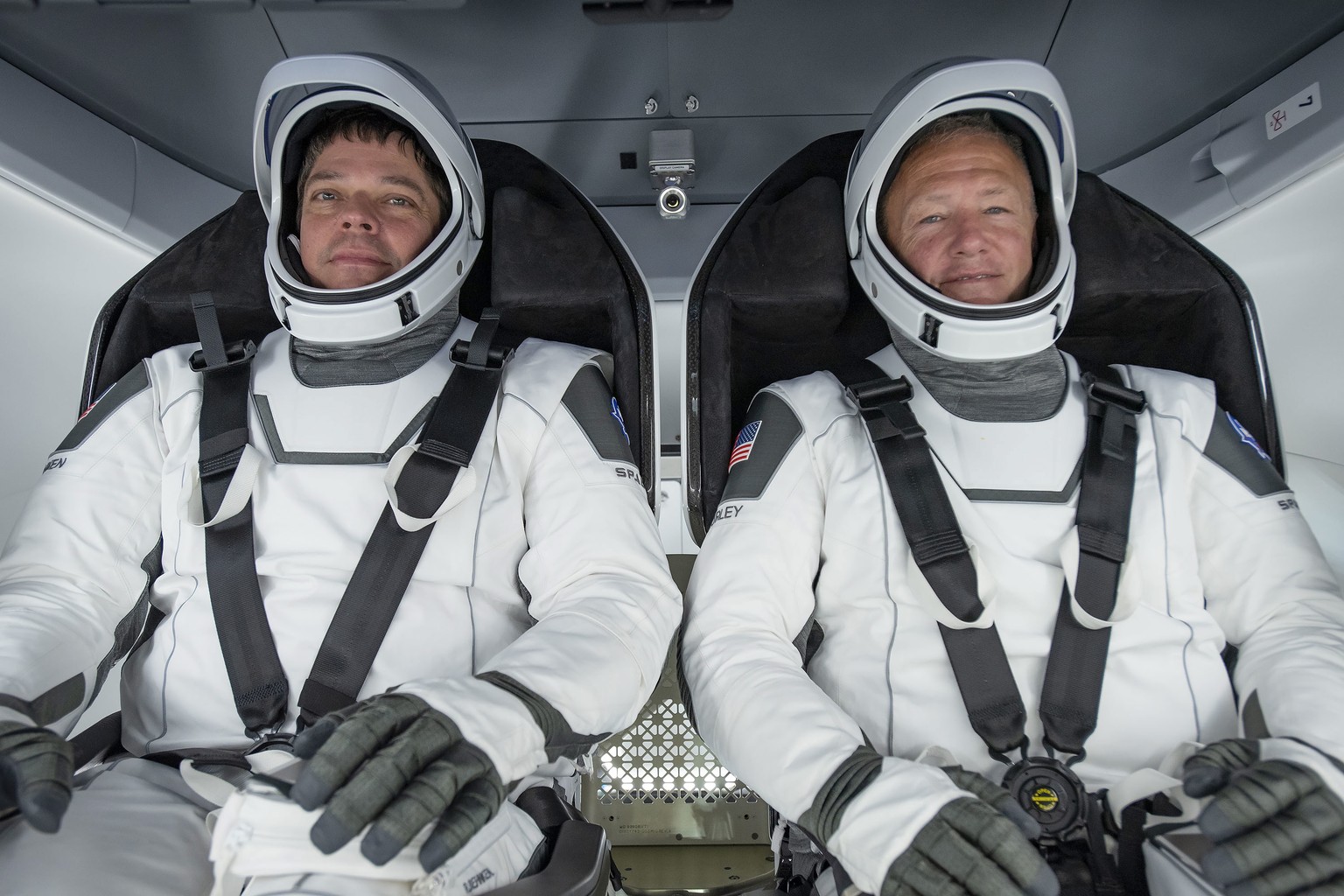 epa08370713 A handout picture made available by SpaceX shows SpaceX NASA astronauts Bob Behnken (L) and Doug Hurley (R) participating in a fully integrated test of critical crew flight hardware ahead  ...