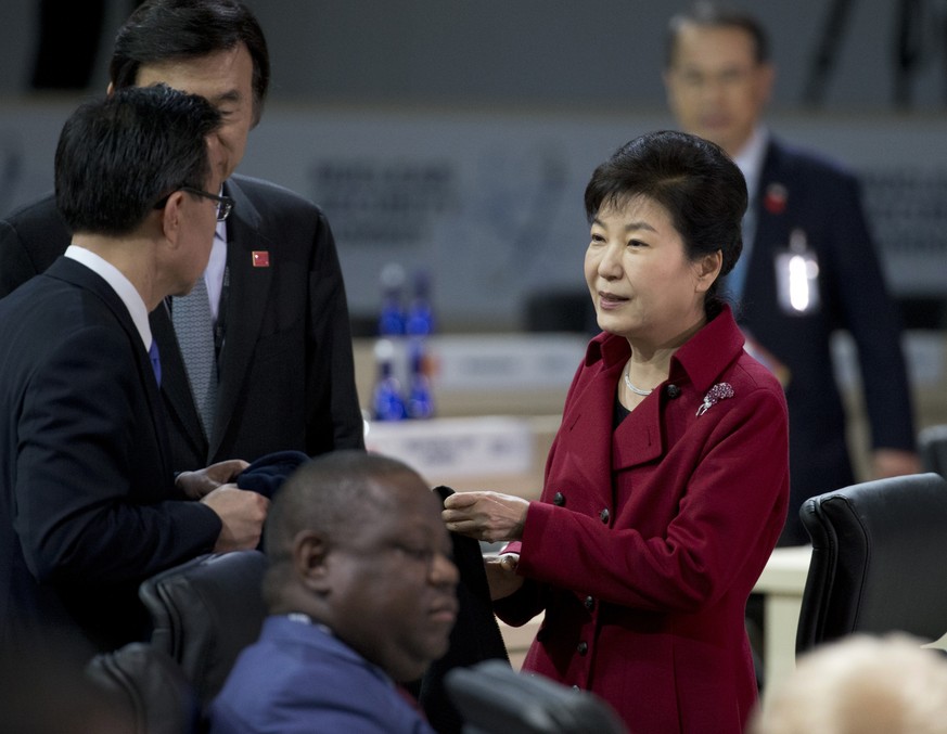 South Korean President Park Geun hye, right, prepares to participate in the afternoon plenary session of the Nuclear Security Summit, Friday, April 1, 2016, in Washington. (AP Photo/Alex Brandon)