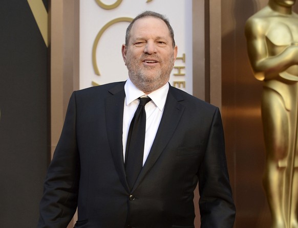FILE - In this March 2, 2014 file photo, Harvey Weinstein arrives at the Oscars at the Dolby Theatre in Los Angeles. The Producers Guild of America has voted unanimously to institute termination proce ...