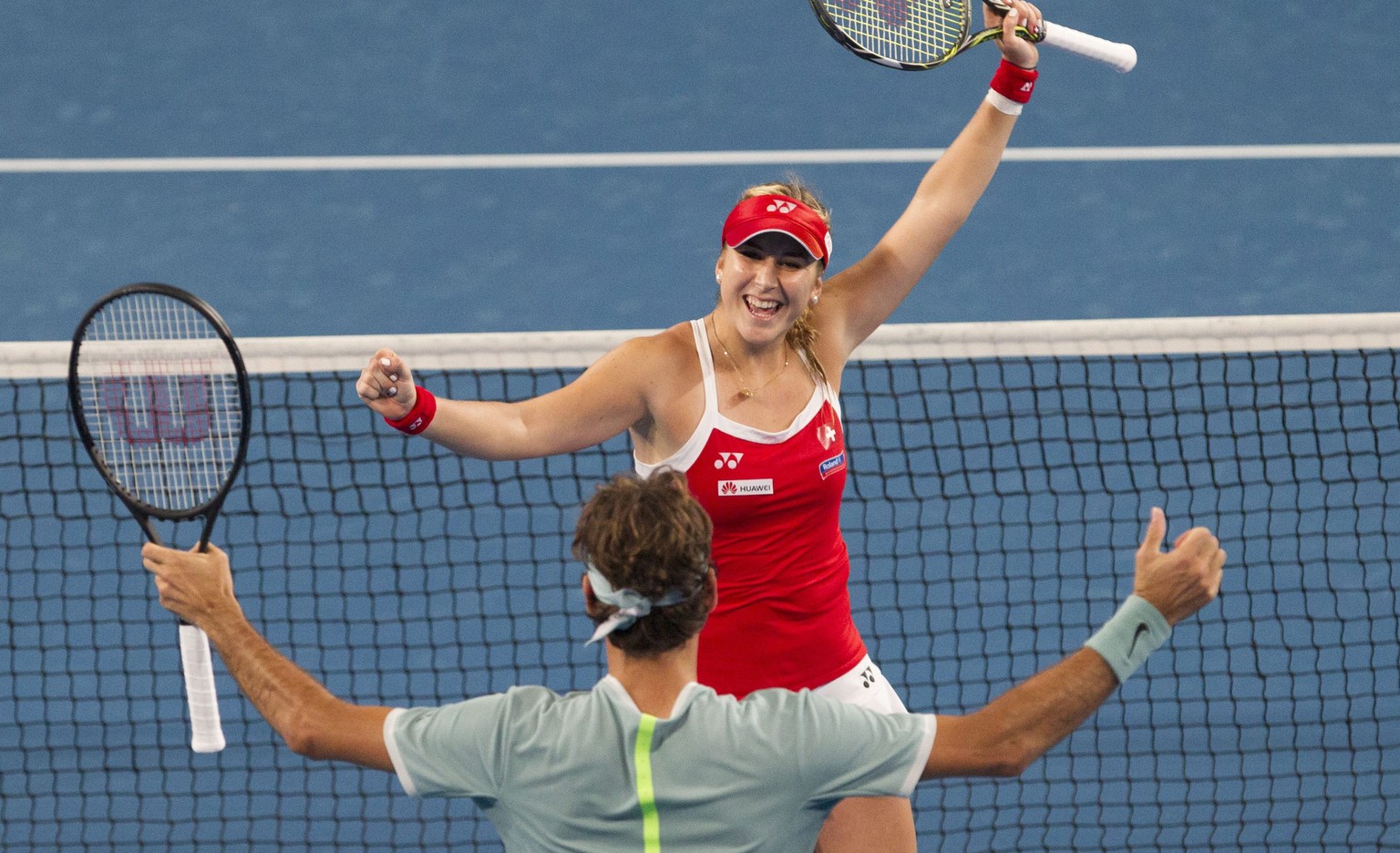 epa05698421 Belinda Bencic and Roger Federer of Switzerland celebrate their win during the mixed doubles match between Switzerland and Germany in session 8 of the Hopman Cup at the Arena in Perth, Aus ...