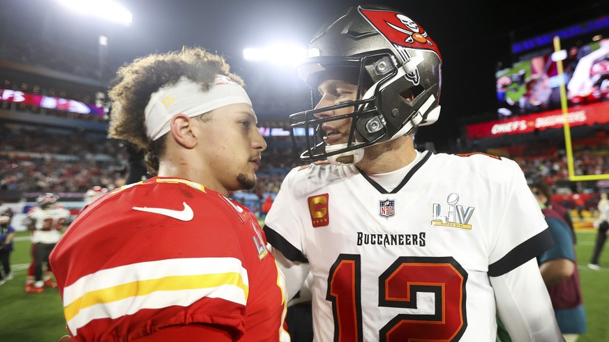 Kansas City Chiefs quarterback Patrick Mahomes (15) and Tampa Bay Buccaneers quarterback Tom Brady (12) embrace following the NFL Super Bowl 55 football game, Sunday, Feb. 7, 2021 in Tampa, Fla. Tampa ...