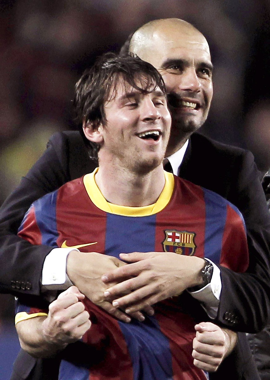 epa08629211 (FILE) A file picture dated 03 May 2011 shows FC Barcelona&#039;s head coach Josep Guardiola embracing Argentinian striker Lionel Messi (front) after the UEFA Champions League semi final s ...