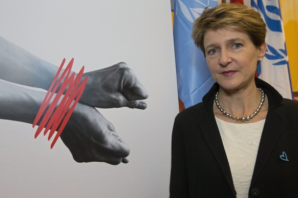 Swiss Justice Minister Simonetta Sommaruga poses near a banner after Launching of the Swiss Week Against Trafficking in Persons, in Geneva, Switzerland, Friday, October 18, 2013. (KEYSTONE/Salvatore D ...