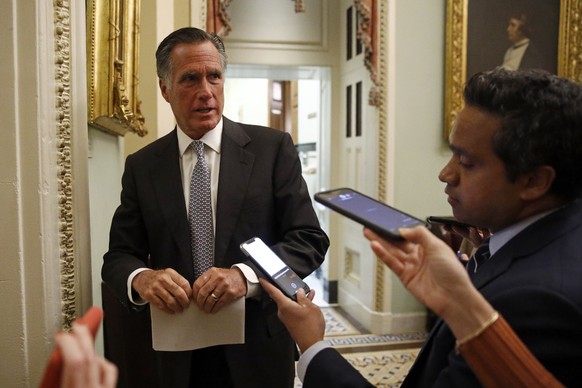 Sen. Mitt Romney, R-Utah, speaks with members of the media as he departs a meeting with Treasury Secretary Steve Mnuchin on an economic lifeline for Americans affected by the coronavirus outbreak on C ...