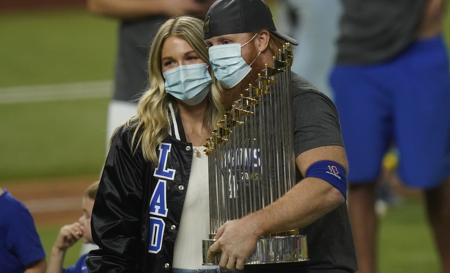 Los Angeles Dodgers third baseman Justin Turner celebrates with the trophy after defeating the Tampa Bay Rays 3-1 to win the baseball World Series in Game 6 Tuesday, Oct. 27, 2020, in Arlington, Texas ...