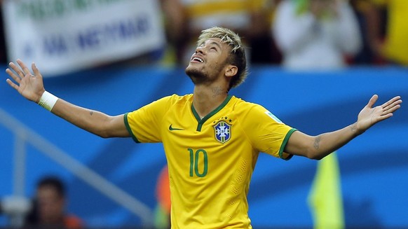 epa04275985 Brazil&#039;s Neymar Jr celebrates his 1-2 goal during the FIFA World Cup 2014 group A preliminary round match between Cameroon and Brazil at the Estadio Nacional in Brasilia, Brazil, 23 J ...