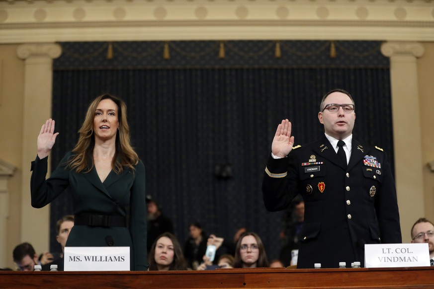 Jennifer Williams, an aide to Vice President Mike Pence, left, and National Security Council aide Lt. Col. Alexander Vindman, are sworn in to testify before the House Intelligence Committee on Capitol ...