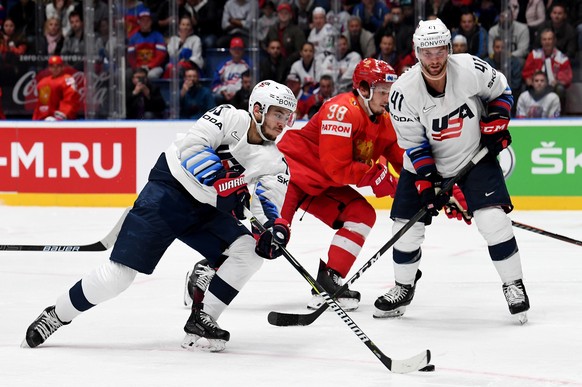 epa07594806 Johnny Gaudreau of US (L) in action during the IIHF World Championship quarter final ice hockey match between Russia and USA at the Ondrej Nepela Arena in Bratislava, Slovakia, 23 May 2019 ...