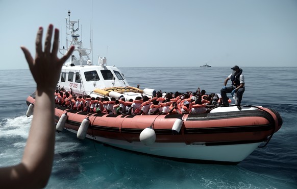 epa06802822 A handout photo made available by NGO &#039;SOS Mediterranee&#039; on 12 June 2018 shows some of the 629 migrants boarding rescue vessel &#039;Aqarius&#039; in the Mediterranean. The rescu ...