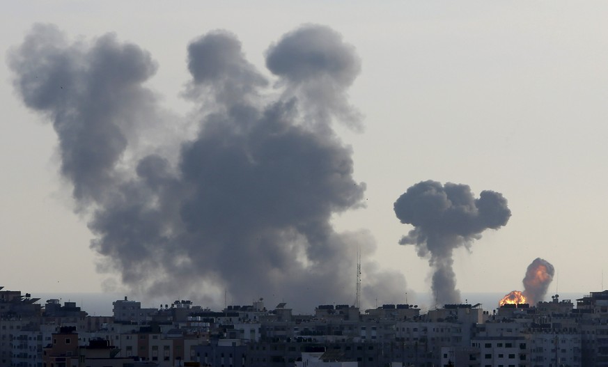 An explosion caused by Israeli airstrikes is seen in Gaza City, Saturday, May 4, 2019. Palestinian militants in the Gaza Strip fired scores of rockets into southern Israel on Saturday, wounding at lea ...