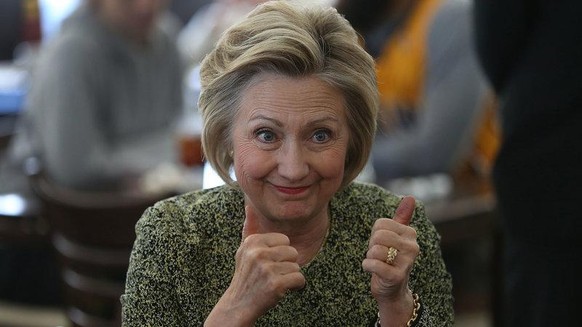 Hillary Clinton gives a thumbs up during a stop at the Lincoln Square pancake house while campaigning in May in Indianapolis.
