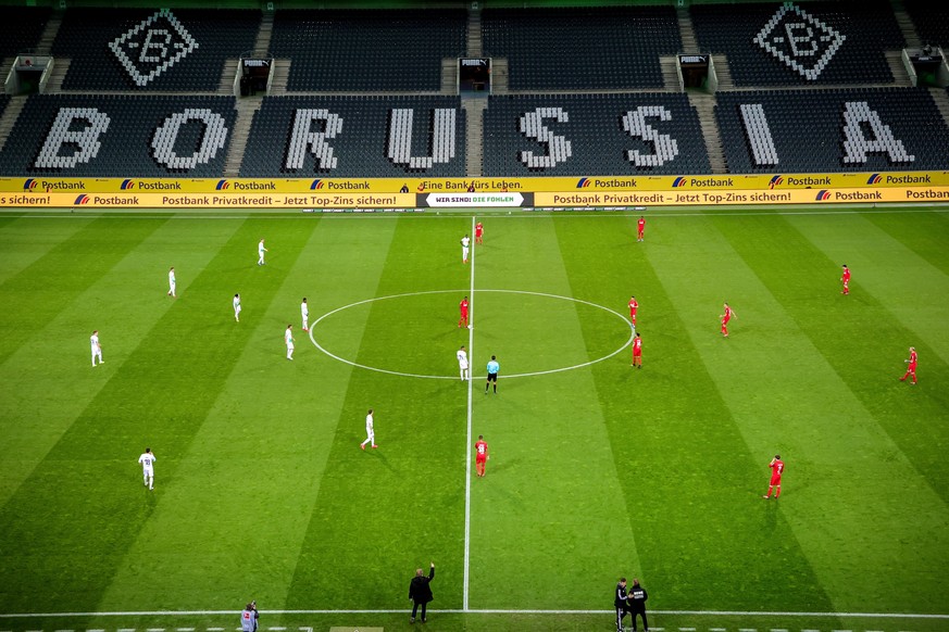 epaselect epa08286794 View of empty stands during the German Bundesliga soccer match between Borussia Moenchengladbach and 1. FC Koeln in Moenchengladbach, Germany, 11 March 2020. he match takes place ...