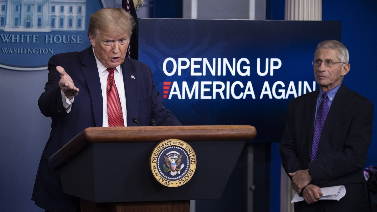 President Donald Trump speaks about the coronavirus, accompanied by Dr. Anthony Fauci, director of the National Institute of Allergy and Infectious Diseases, in the James Brady Press Briefing Room of  ...