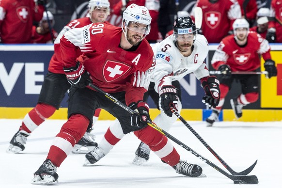 Switzerland&#039;s Roman Josi, left, against Austria`s Thomas Raffl during the game between Switzerland and Austria, at the IIHF 2019 World Ice Hockey Championships, at the Ondrej Nepela Arena in Brat ...