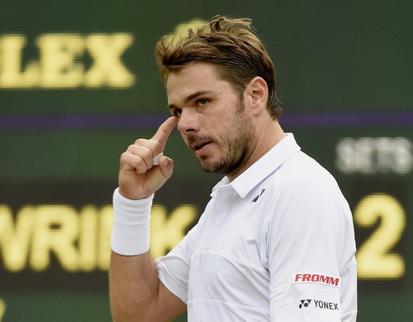 epa04837536 Stan Wawrinka of Switzerland in action against Richard Gasquet of France during their quarter final match for the Wimbledon Championships at the All England Lawn Tennis Club, in London, Br ...