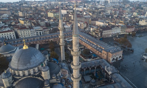 epa08865752 An aerial photo taken with a drone shows the New Eminonu Mosque during lockdown in Istanbul, Turkey, 06 December 2020. Turkey imposed curfews on weekdays and full lockdowns over weekends t ...