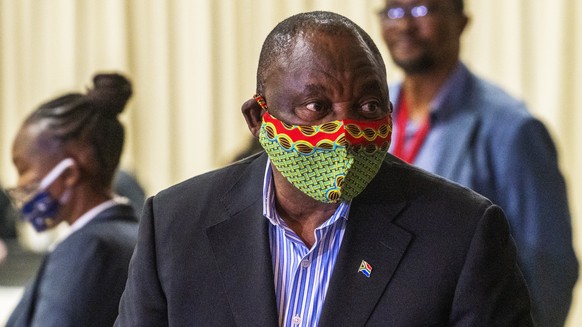 FILE - In this April 24, 2020, photo, South African President Cyril Ramaphosa arrives at the NASREC Expo Centre in Johannesburg. People have taken to the streets around the world to demonstrate in sup ...