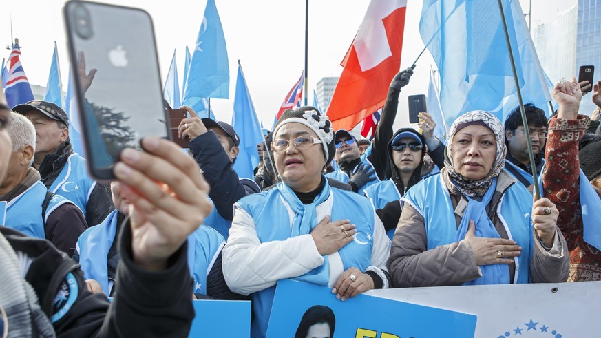 Uyghurs people demonstrate against China during the Universal Periodic Review of China by the Human Rights Council, on the place des Nations in front of the European headquarters of the United Nations ...