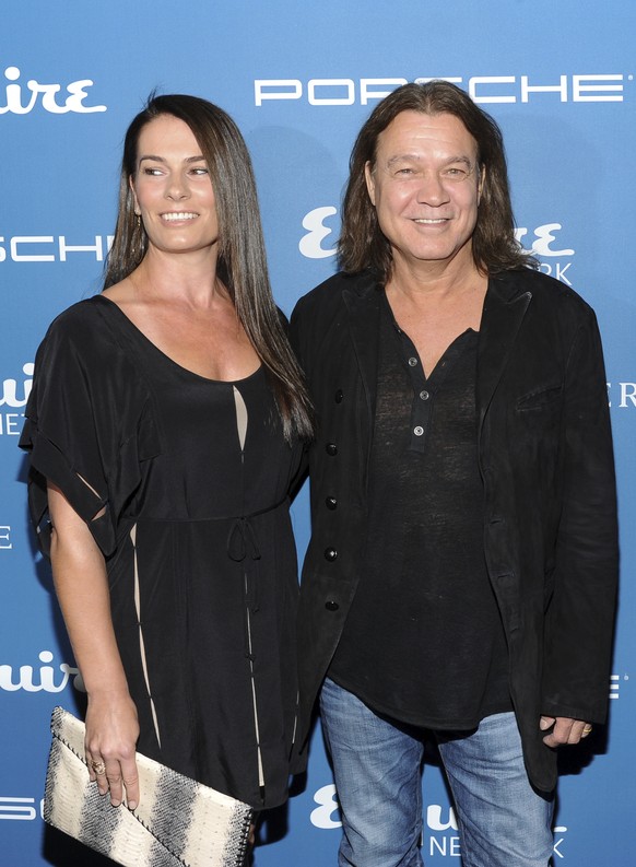 FILE - Musician Eddie Van Halen and his wife Janie Liszewski attend the Esquire 80th Anniversary and Network Launch Event in New York on Sept. 17, 2013. Van Halen, who had battled cancer, died Tuesday ...
