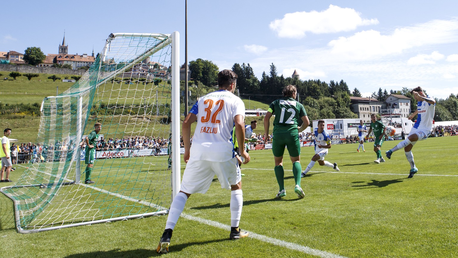 Grasshopper&#039;s defender Cedric Zesiger, 2nd right, shoots the ball, during the Swiss Cup Round of 64 between CS Romontois and Grasshopper Club Zuerich, at the stade du Glaney stadium, in Romont, S ...