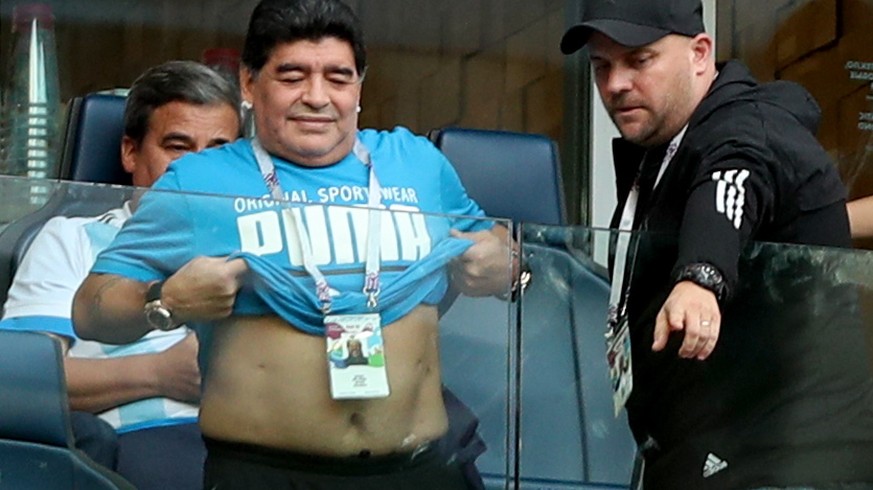 epa06842387 Argentinian soccer legend Diego Maradona reacts prior to the FIFA World Cup 2018 group D preliminary round soccer match between Nigeria and Argentina in St.Petersburg, Russia, 26 June 2018 ...