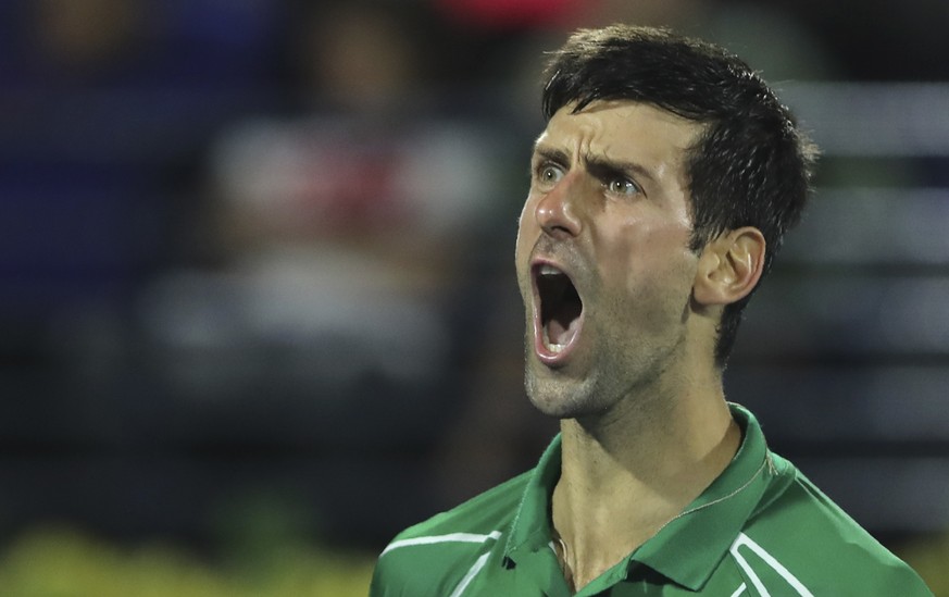Serbia&#039;s Novak Djokovic reacts after he got a point against Stefanos Tsitsipas of Greece during the final match of the Dubai Duty Free Tennis Championship in Dubai, United Arab Emirates, Saturday ...