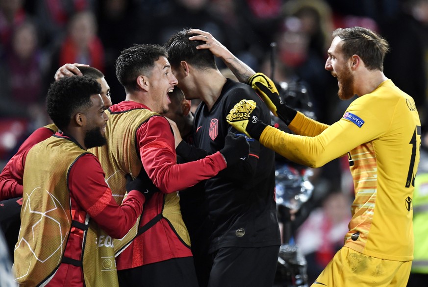 epa08287528 Players of Atletico celebrate after scoring their second goal during the UEFA Champions League Round of 16, second leg match between Liverpool FC and Atletico Madrid in Liverpool, Britain, ...