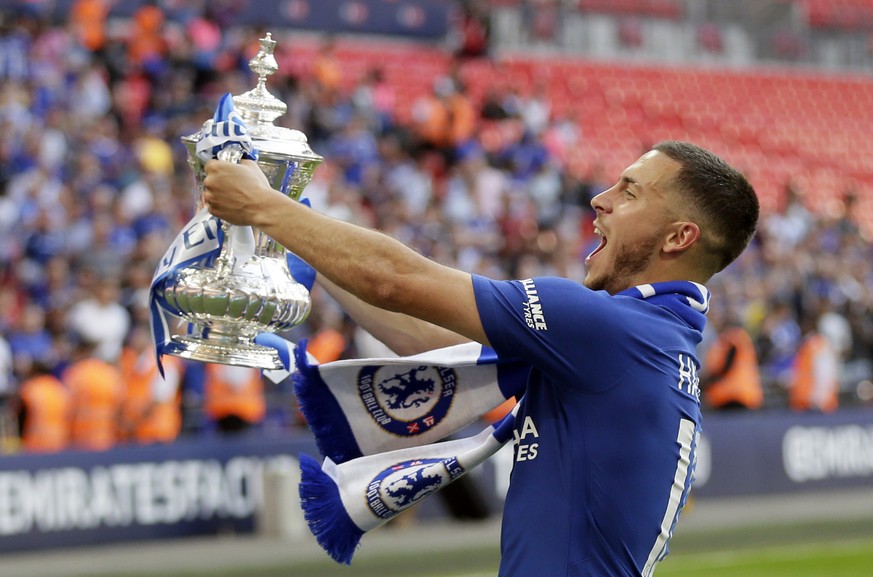 Chelsea&#039;s Eden Hazard celebrates with the trophy after winning the English FA Cup final soccer match between Chelsea and Manchester United at Wembley stadium in London, Saturday, May 19, 2018. Ch ...
