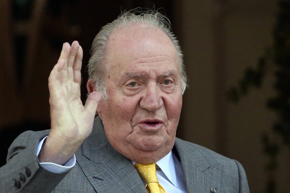 FILE - In this March 10, 2018, file photo, Spain&#039;s former monarch King Juan Carlos waves upon his arrival to the Academia Diplomatica de Chile, in Santiago. The Spanish parliament&#039;s decision ...
