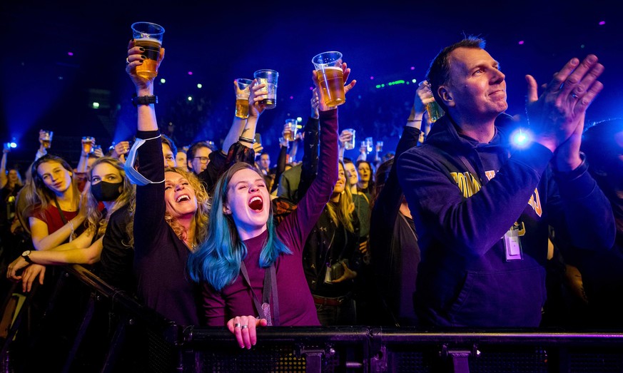 epa09059932 Visitors cheer during a performance by Andre Hazes in the Ziggo Dome in Amsterdam, Netherlands, 07 March 2021. The event is part of a series of trial events in which Fieldlab is investigat ...