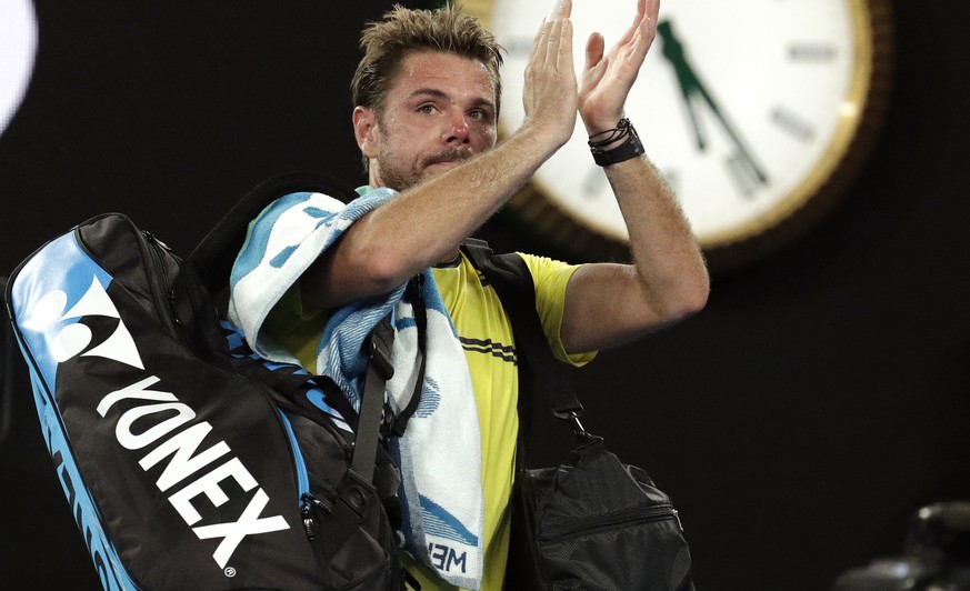 Switzerland&#039;s Stan Wawrinka waves as he leaves Rod Laver Arena after his second round loss to Canada&#039;s Milos Raonic at the Australian Open tennis championships in Melbourne, Australia, Thurs ...