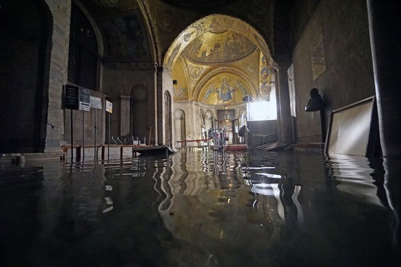 epa08871103 The San Marco Basilica is flooded by high water in Venice, Italy, 08 December 2020. The high water or Acqua alta phenomenon takes place in the winter in Venice. EPA/ANDREA MEROLA