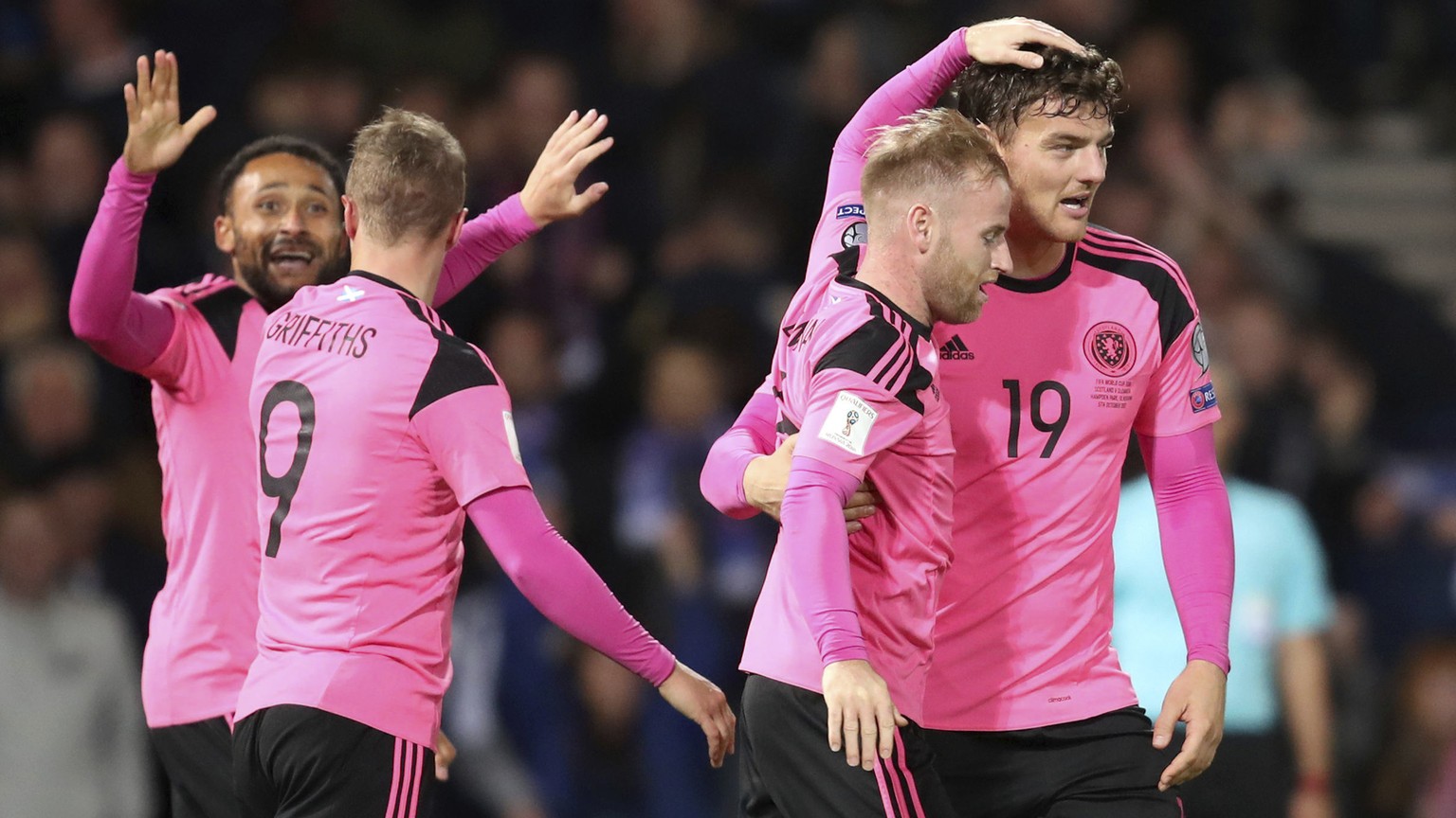 Scotland&#039;s Chris Martin, right, celebrates with teammates after scoring his side&#039;s first goal of the game during their 2018 World Cup Group F qualifying soccer match against Slovakia at Hamp ...