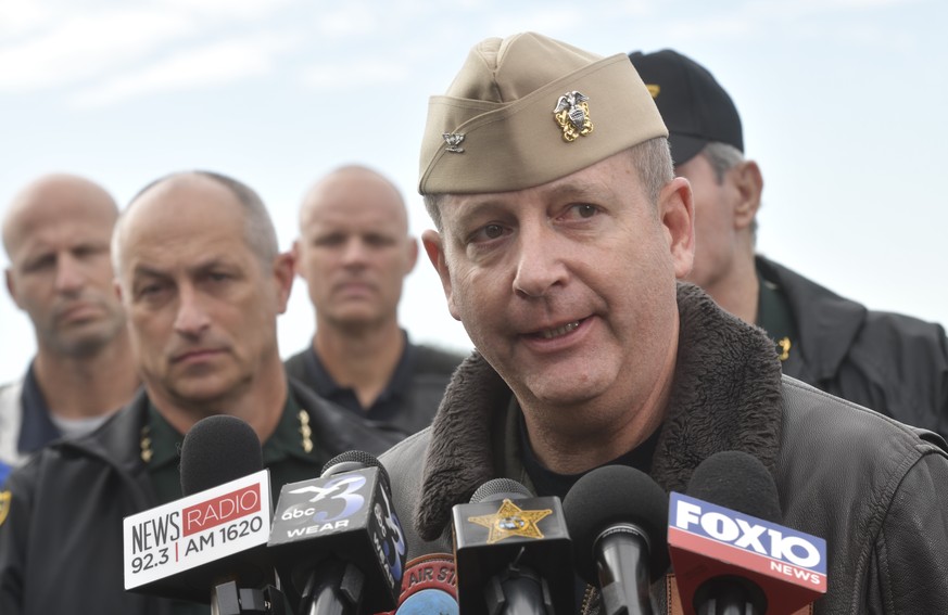 Navy Capt. Tim Kinsella briefs members of the media following a shooting at the Naval Air Station in Pensacola, Fla., Friday, Dec. 6, 2019. The US Navy is confirming that a shooter is dead and several ...