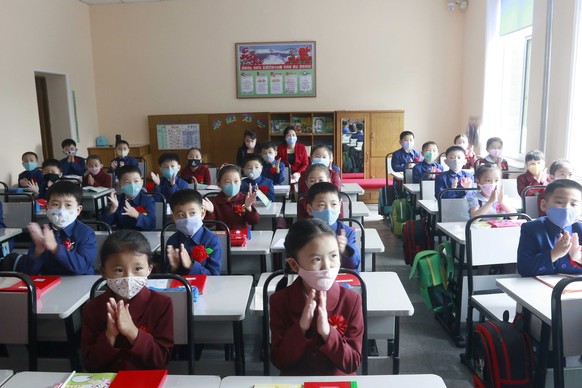 Students wearing face masks take a class at Kim Song Ju Primary School in Pyongyang, North Korea, Wednesday, June 3, 2020. All the schools in the country start their lessons this month after delays ov ...