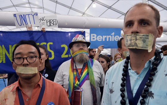 Supporters of former Democratic presidential candidate Bernie Sanders protest in the media center after they walked out of the convention once Hillary Clinton was nominated during the Democratic Natio ...