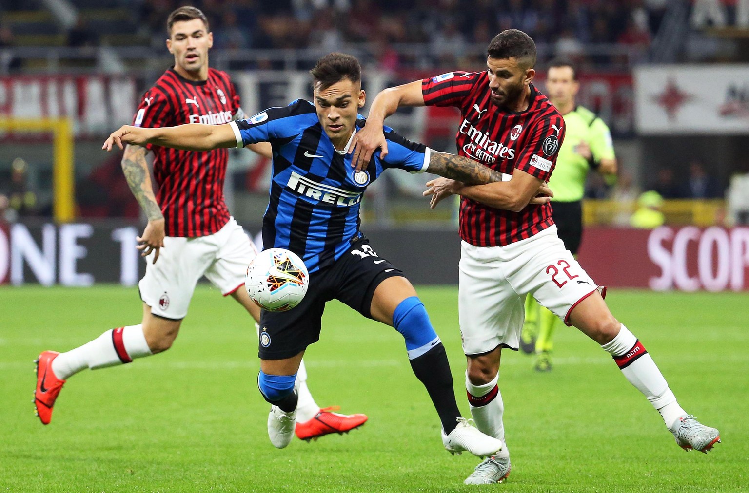 epa07859978 Milan&#039;s Mateo Musacchio (R) in action against Inter&#039;s Lautaro Martinez (C) during the Italian Serie A soccer match between AC Milan and Inter Milan at Giuseppe Meazza stadium in  ...