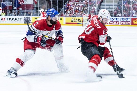 epa07588868 Czech&#039;s Radko Gudas (L) in action against Switzerland&#039;s Christoph Bertschy during the IIHF World Championship group B ice hockey match between the Czech Republic and Switzerland  ...