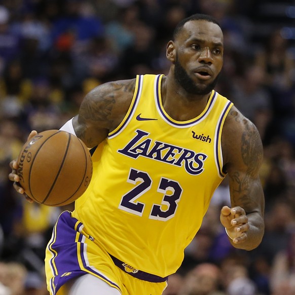 FILE - In this Saturday, March 2, 2019 file photo, Los Angeles Lakers forward LeBron James (23) controls the ball in the second half during an NBA basketball game against the Phoenix Suns in Phoenix.  ...
