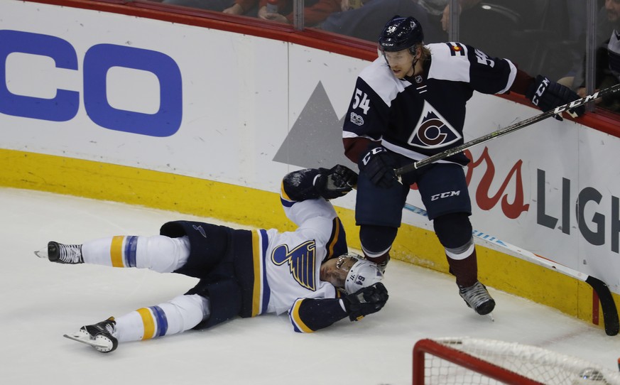 St. Louis Blues right wing Nail Yakupov, left, of Russia, is run into by Colorado Avalanche defenseman Anton Lindholm, of Sweden, in the third period of an NHL hockey game Friday, March 31, 2017, in D ...