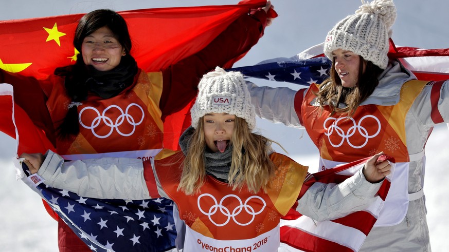 Gold winner Chloe Kim, of the United States, front, silver winner Liu Jiayu, of China, left, and bronze winner Arielle Gold, of the United States, celebrate after the women&#039;s halfpipe finals at P ...