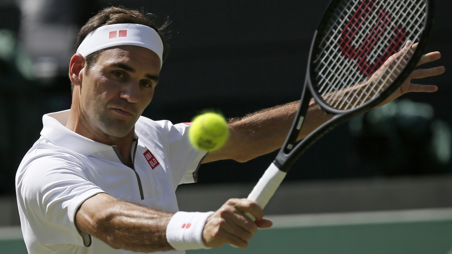 Switzerland&#039;s Roger Federer returns to Britain&#039;s Jay Clarke in a Men&#039;s singles match during day four of the Wimbledon Tennis Championships in London, Thursday, July 4, 2019. (AP Photo/T ...