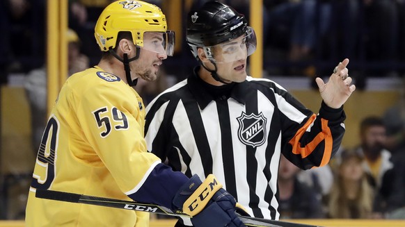 Nashville Predators defenseman Roman Josi (59), of Switzerland, argues a call with referee Jean Hebert (15) during the first period in Game 2 of an NHL hockey first-round playoff series between the Pr ...
