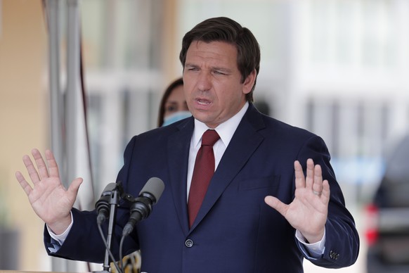 FILE - In this Thursday, May 14, 2020, file photo, Florida Gov. Ron DeSantis speaks at a news conference in Doral, Fla. A federal appellate court has stayed a lower court ruling that gave impoverished ...
