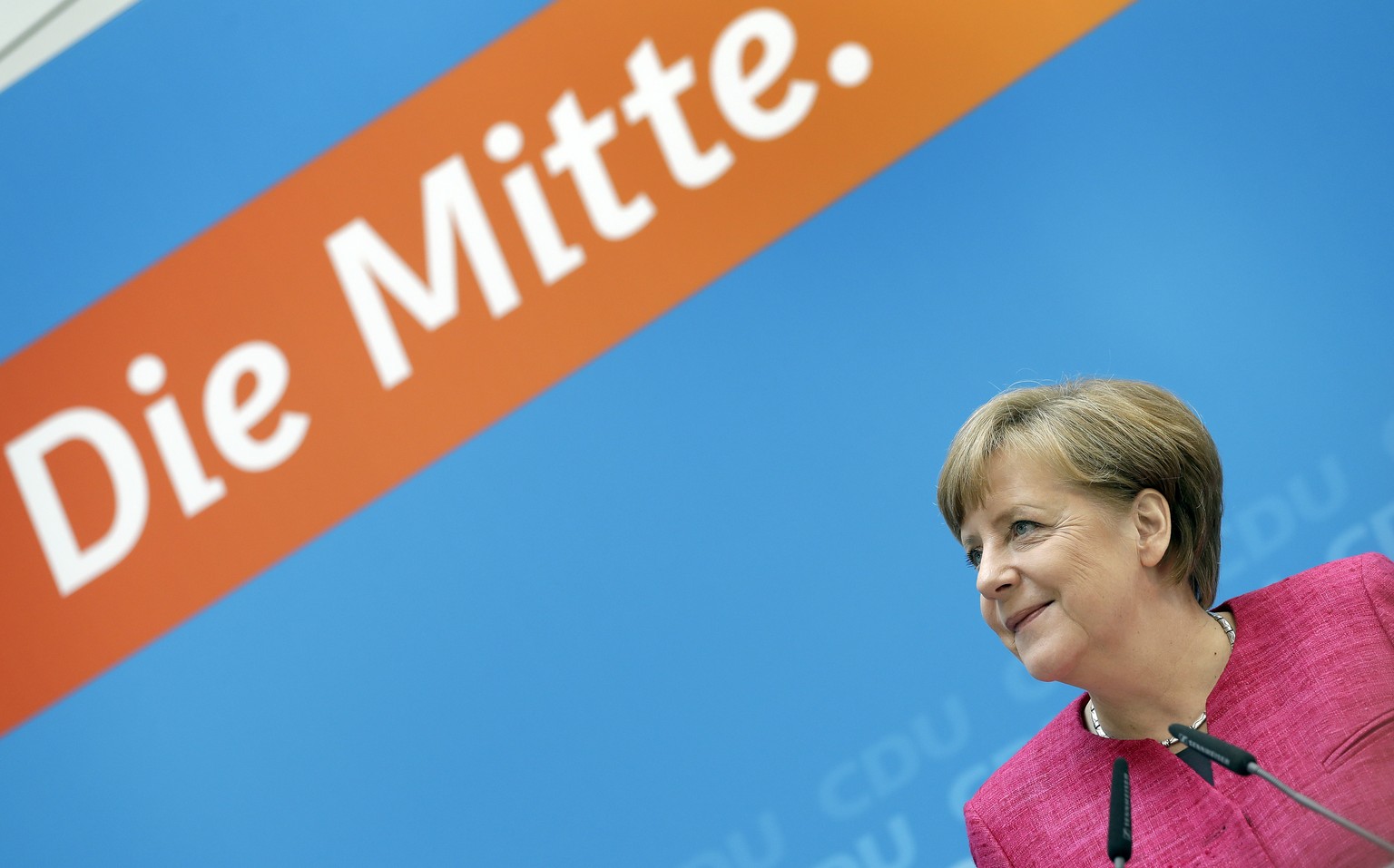 German Chancellor and chairwoman of the German Christian Democratic Party (CDU), Angela Merkel, smiles as she arrives for a press conference at the party&#039;s headquarters in Berlin, Germany, Monday ...
