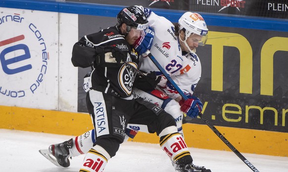 From left, Lugano?s player Linus Klasen and Zurich&#039;s player Roman Wick, during the preliminary round game of National League A (NLA) Swiss Championship 2019/20 between HC Lugano and ZSC Lions at  ...