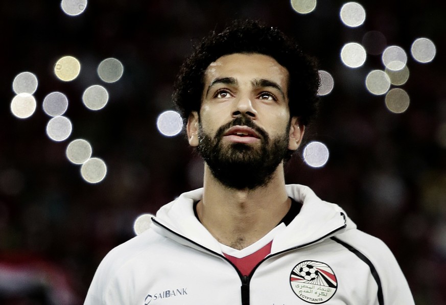 FILE - In this Oct. 8, 2017 file photo, Egypt&#039;s Mohamed Salah sings the national anthem before the 2018 World Cup group E qualifying soccer match between Egypt and Congo at the Borg El Arab Stadi ...