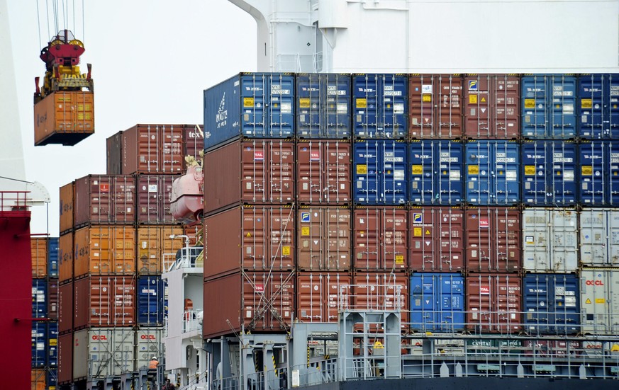 FILE- In this file photo taken on Aug. 5, 2010, a container is loaded onto a cargo ship at the Tianjin port in China. China&#039;s exports fell again in October in a fresh sign of weak global demand t ...