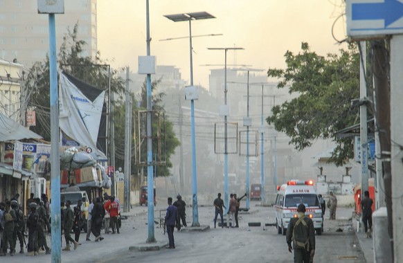 epa08978693 A general view at the scene of a bomb explosion at the Afrik Hotel in Mogadishu, Somalia, 31 January 2021. According to reports, three people have been killed and six other have been wound ...